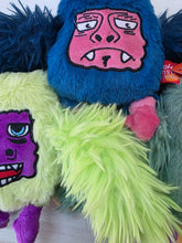 Load image into Gallery viewer, Colorful plush toys with cartoon face designs on a white background